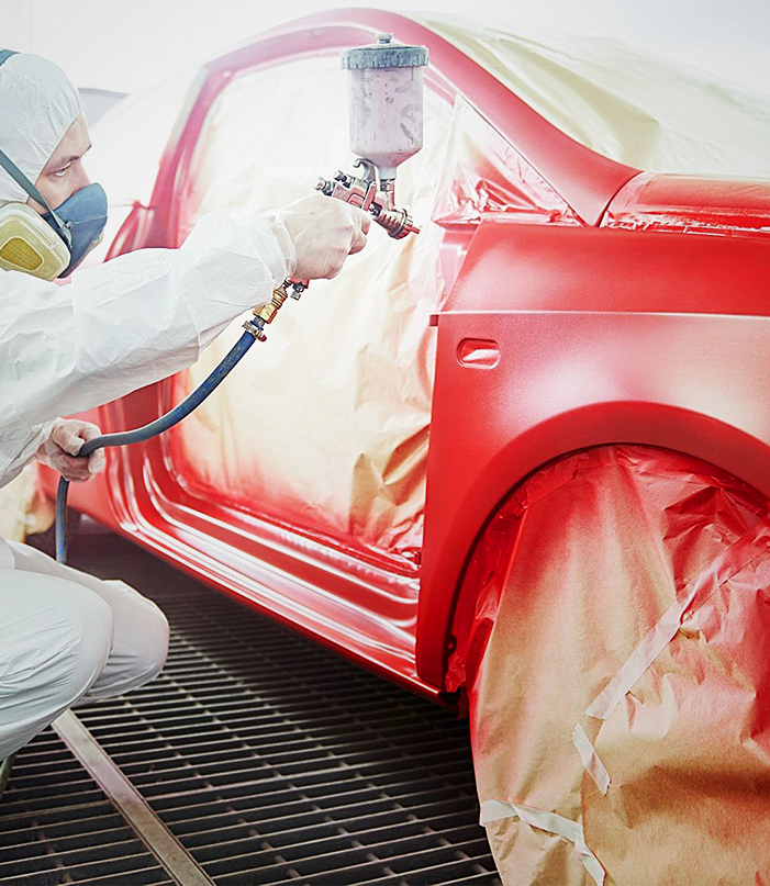 Certified technicians performing auto paint jobs at DNA Collision Center in Houston